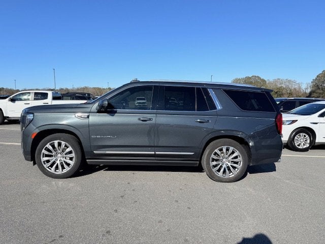 2021 GMC Yukon Denali in Hunter Metallic — front three-quarter view