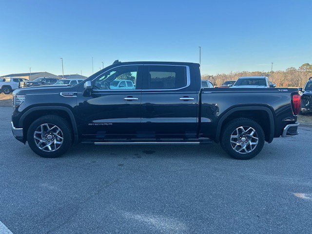 2023 GMC Sierra 1500 SLT in Titanium Rush Metallic — front three-quarter view