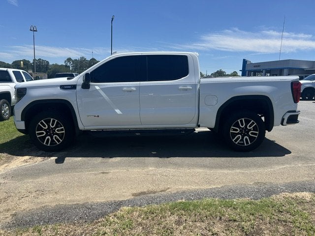 2023 GMC Sierra 1500 AT4 in Summit White — front three-quarter view