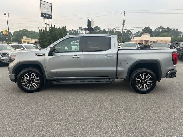 2023 GMC Sierra 1500 AT4 in Sterling Metallic — front three-quarter view
