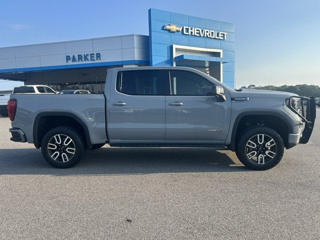 2025 GMC Sierra 1500 AT4 in Thunderstorm Gray — front three-quarter view